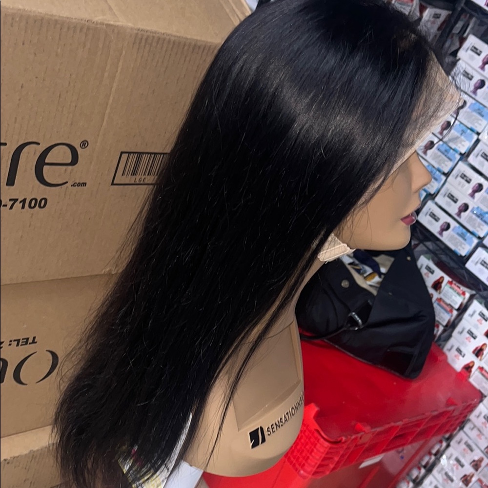 Long Sleek Black Wig with Glossy Finish and Smooth Texture